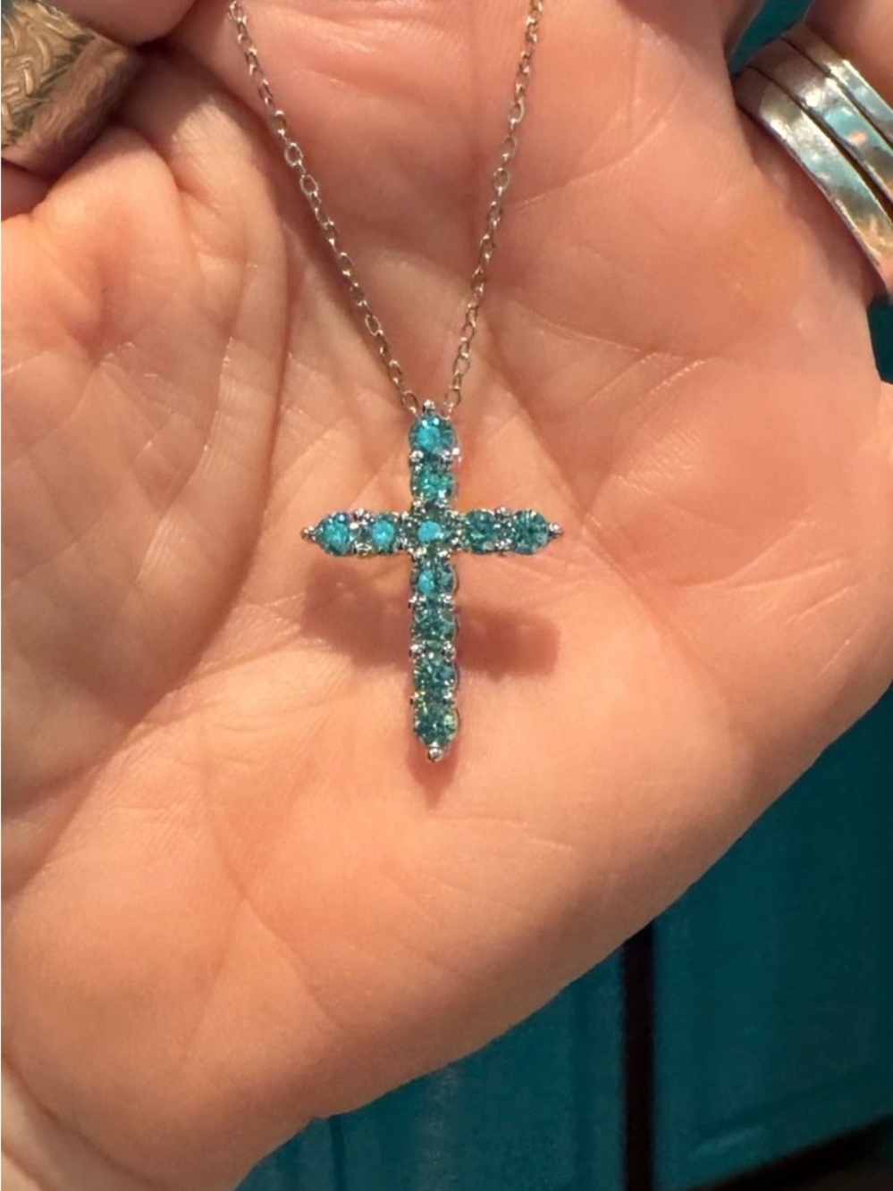 1.1 ctw blue/green moissanite cross necklace